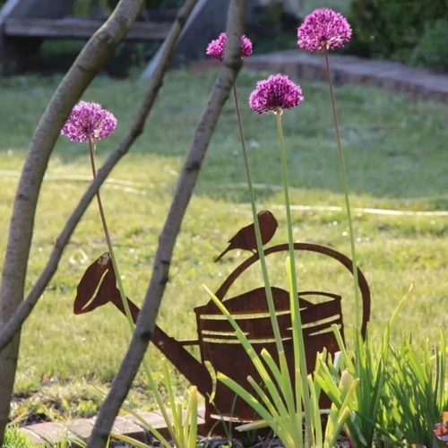 Locsolókanna sziluett madárral 